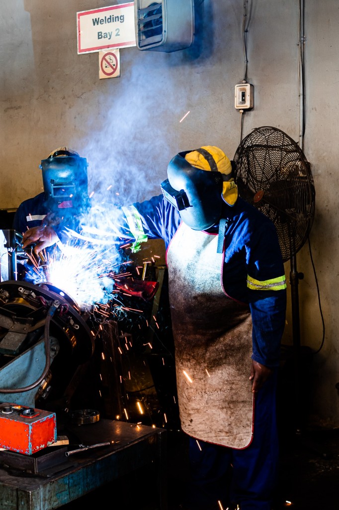 Welders in protective gear at Welding Bay 2, Titan Pumps workshop, Orkney