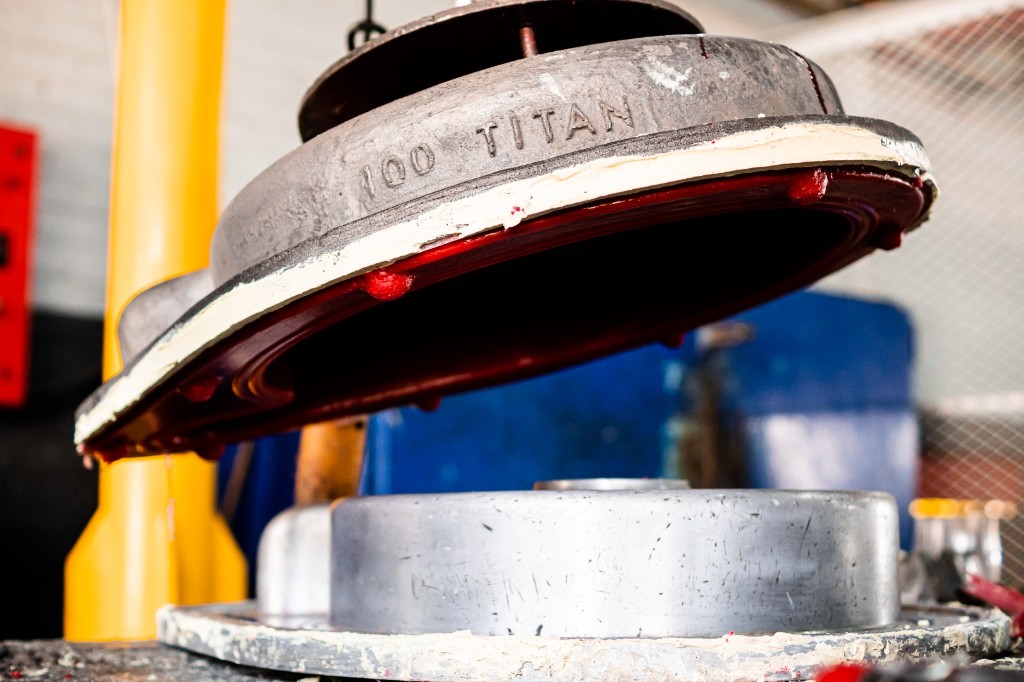 Titan Pumps: heavy-duty pump casting with TITAN embossed on the metal, red wear lining, in the factory